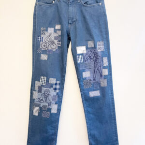 Jeans with hand embroidery and patches