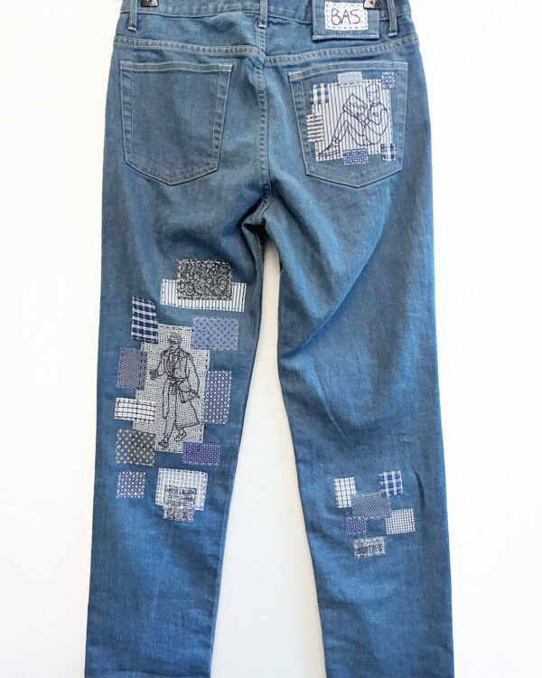 Jeans with hand embroidery and patches